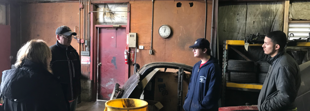 people standing in a garage